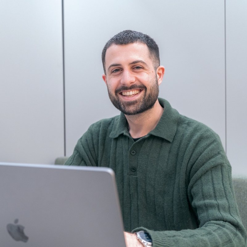 Hod Cohen, founder of HC Web Development, working at his laptop